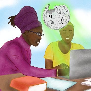 Dos mujeres negras trabajando juntas con una computadora