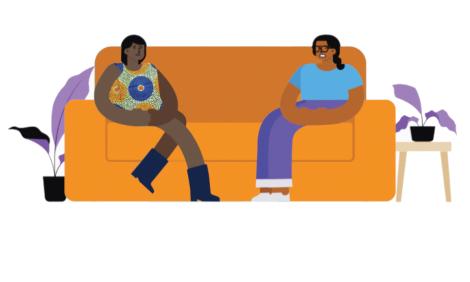 two women talking in a couch