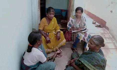 Parijatha interviewing a group of domestic workers.