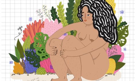 Woman sitting surrounded by plants