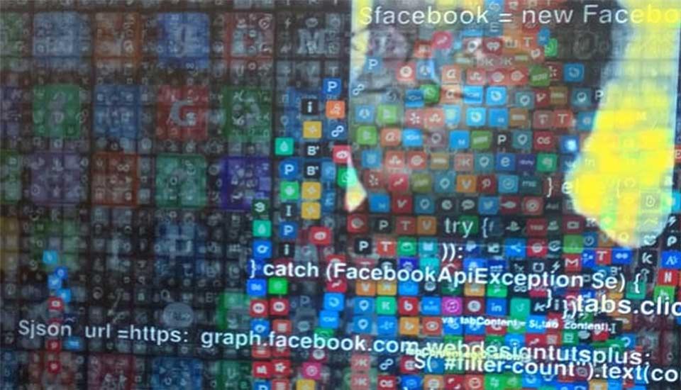 Image description: Visible outline of person against wall of apps Image description: Visible outline of person against wall of apps